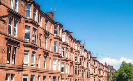 Photo shows a row of tenements in Glasgow